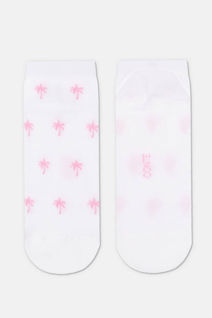 A pair of white ankle socks, with the left sock featuring a repeating pattern of small pink palm trees and the right sock showing a faint pink brand logo centered on the back.