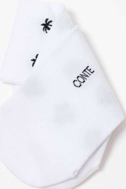A pair of folded white ankle socks featuring a black palm tree icon and the word CONTE printed in black text.