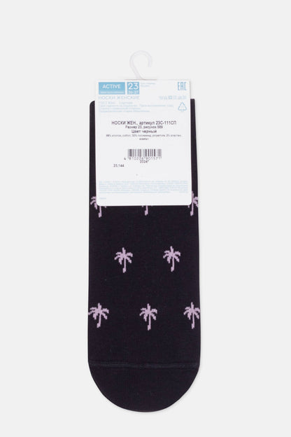 A pair of black women's crew socks featuring a repeating pattern of small, light purple palm trees against a dark background, displayed flat on a white hanger.