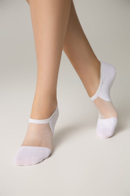 White low-cut socks with a sheer, sparkling mesh top panel worn on a pair of legs against a plain light gray background.