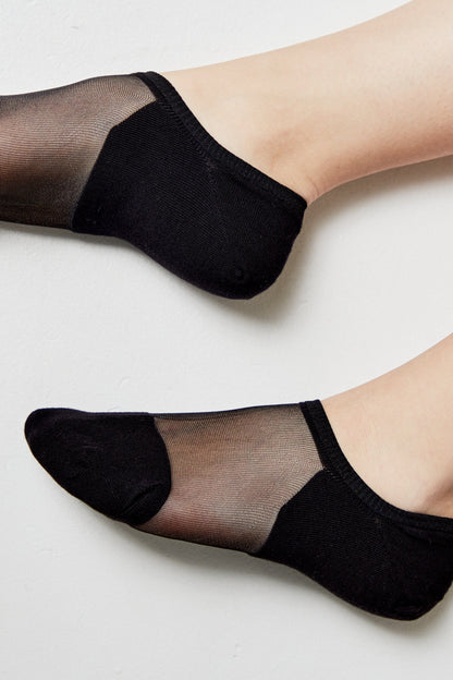 A pair of black ankle socks featuring sheer mesh panels across the top of the foot against a plain white background.