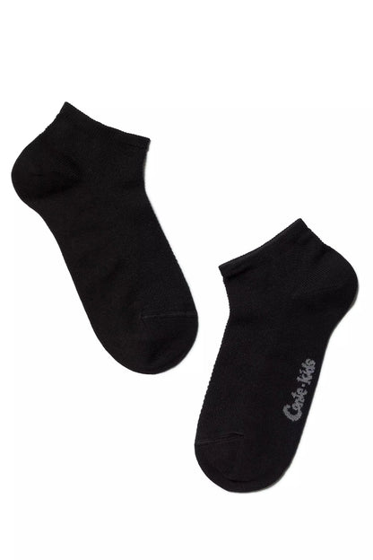 A pair of black ankle socks are displayed against a plain white background, with a grey logo visible on the side of one sock.