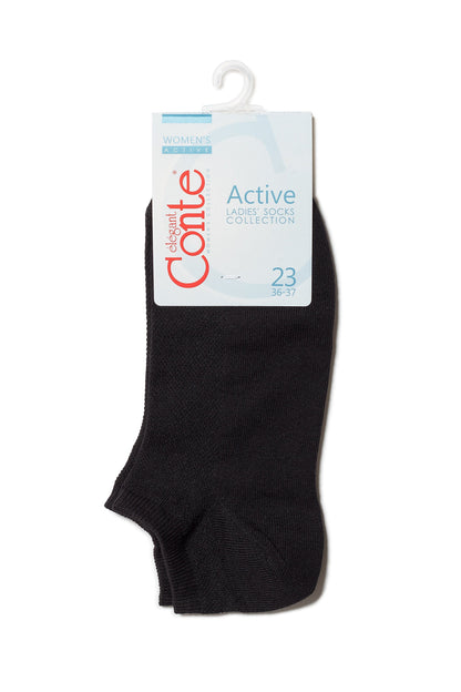 A pair of black ankle socks attached to a cardboard retail hanger.