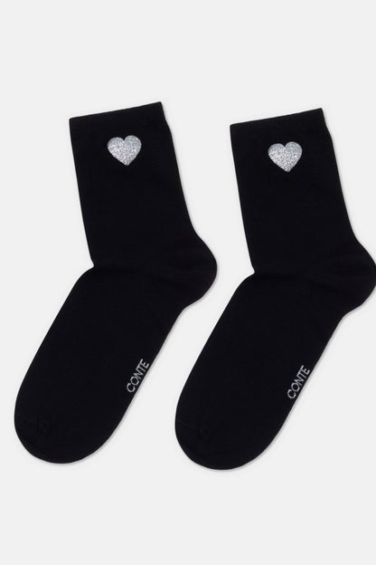 A pair of black ankle socks featuring a small, glittery silver heart detail on the outer side and the text "CONTE" printed in white on the foot.
