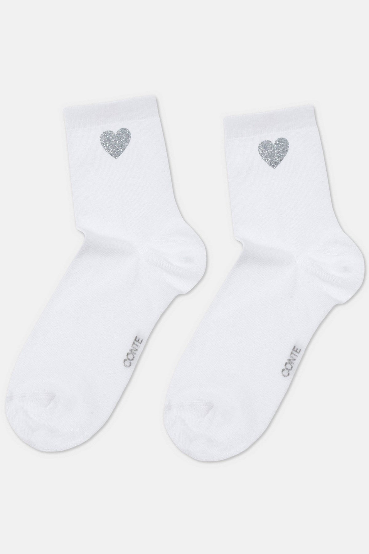 A pair of white ankle socks, each featuring a small, silver glittery heart design on the outer side and the text "CONTE" printed on the foot.