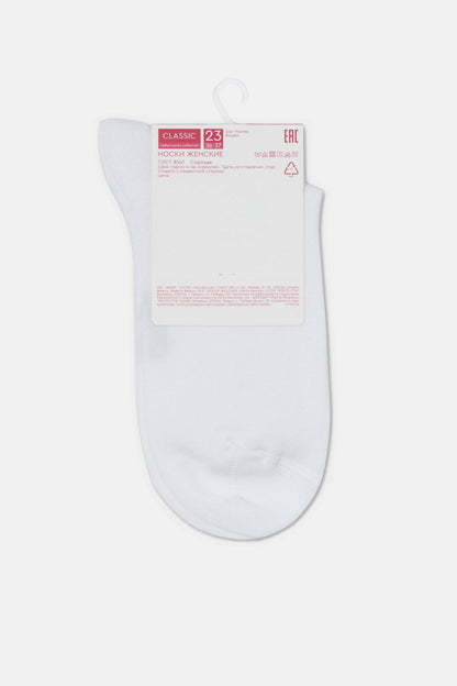 A plain white ankle sock with a cardboard packaging tag attached at the top.