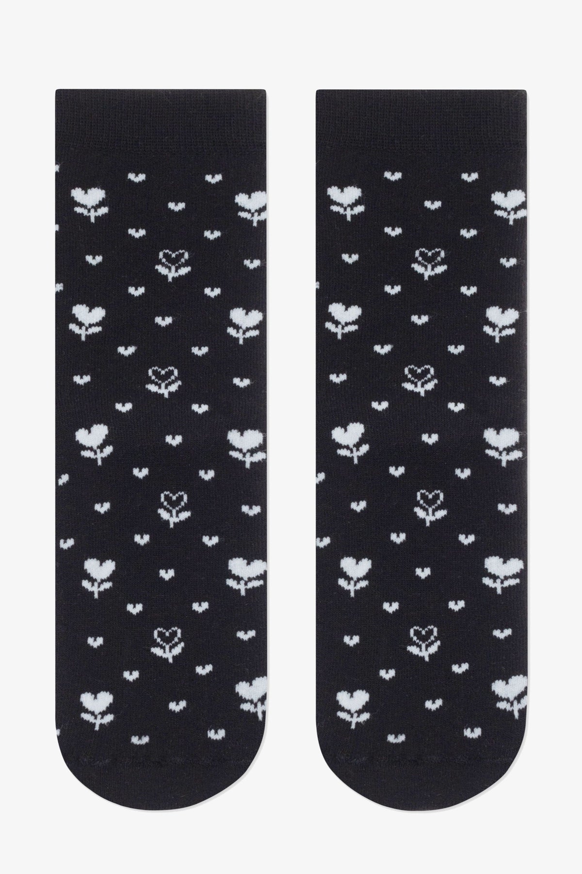 A pair of black ankle socks featuring a repeating pattern of small white heart-shaped flowers and tiny dots.