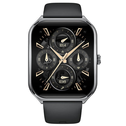 A rectangular smartwatch with a polished metallic frame and a black silicone strap features a digital watch face with four circular mechanical-style gauges against a black background.