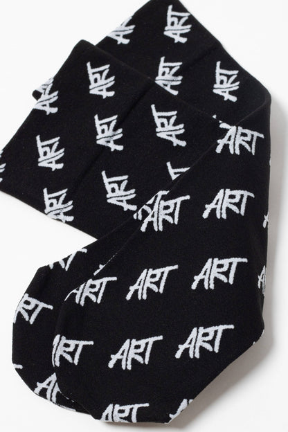 A pair of black socks patterned with a repeated white graffiti-style ART text design.