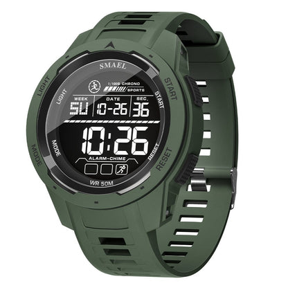 A matte olive green digital sports watch with a round face, thick resin strap, and a backlit LCD display showing the time, date, and day of the week.