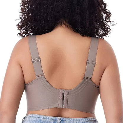 A beige full-coverage bra viewed from the back, featuring wide adjustable straps and a hook-and-eye closure against a plain white background.