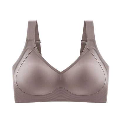 A taupe-colored wireless bra featuring molded cups, wide supportive straps, and a seamless design against a white background.
