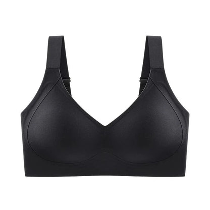A black wireless bra with molded cups and wide shoulder straps set against a white background.