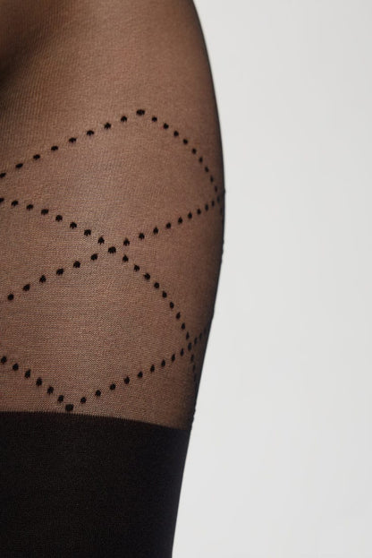 Sheer black pantyhose featuring a textured diamond pattern formed by small dot accents, ending in a solid black opaque section at the lower thigh.