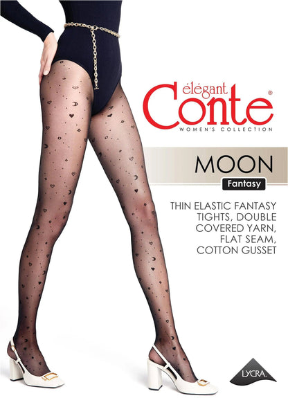 Sheer black tights featuring a pattern of small moons, stars, and hearts worn with a black bodysuit and white heeled sandals.