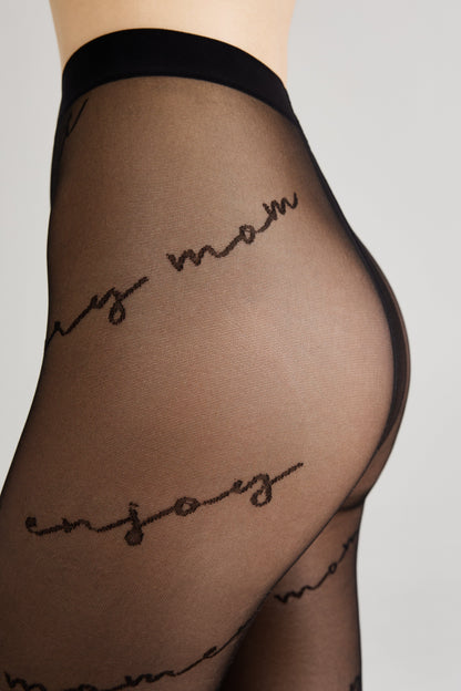 Black sheer pantyhose featuring a repeating script text pattern on the leg.