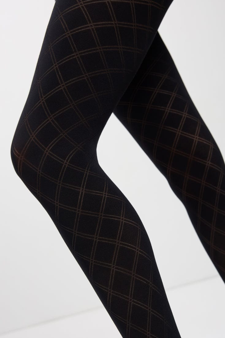 Black tights featuring a subtle, repeating diamond argyle pattern against a solid dark background on a pair of legs.
