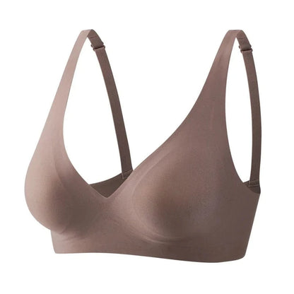 A seamless mauve-colored wireless bra featuring a deep V-neckline and adjustable thin shoulder straps against a plain white background.