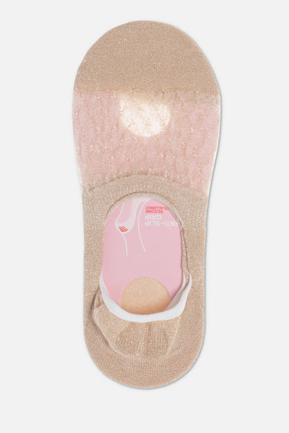 A beige shimmer low-cut liner sock with a sheer top panel and a pink inner heel grip featuring anti-slip branding.
