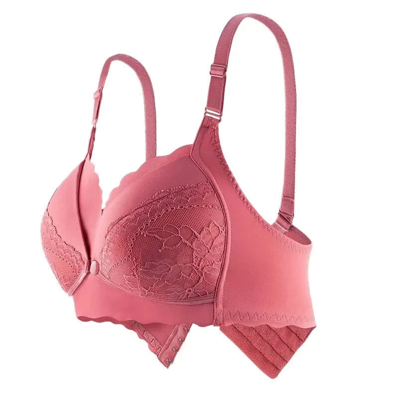 A pink nursing bra featuring scalloped edges, floral lace detailing on the cups, and adjustable shoulder straps against a white background.