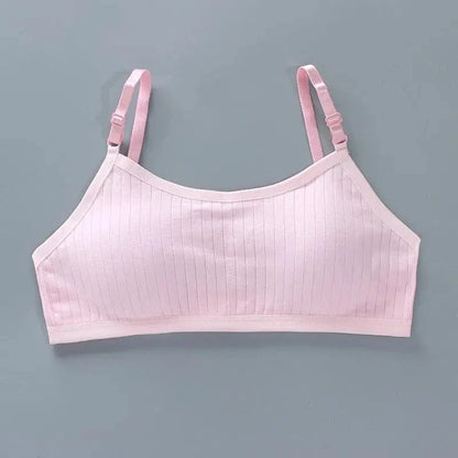 A light pink, ribbed camisole-style crop top with thin, adjustable shoulder straps, displayed flat against a plain grey background.