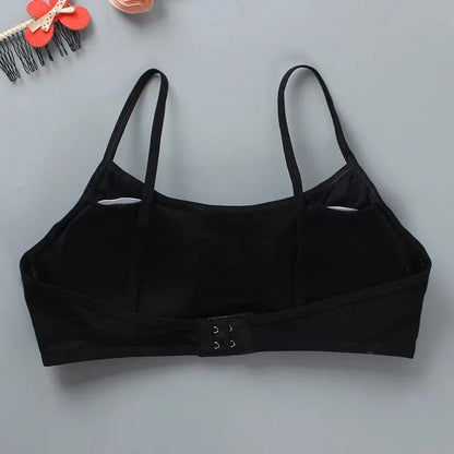 A black camisole-style bralette featuring thin shoulder straps and a back hook-and-eye closure, displayed against a light gray background.