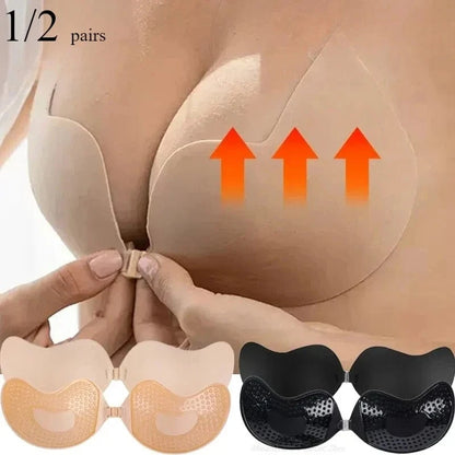 Two adhesive strapless bras, one beige and one black, are displayed below a person demonstrating how to apply the beige bra to lift the chest.