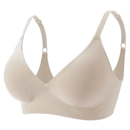 A beige wireless bra featuring a smooth, seamless V-neck design with adjustable shoulder straps.