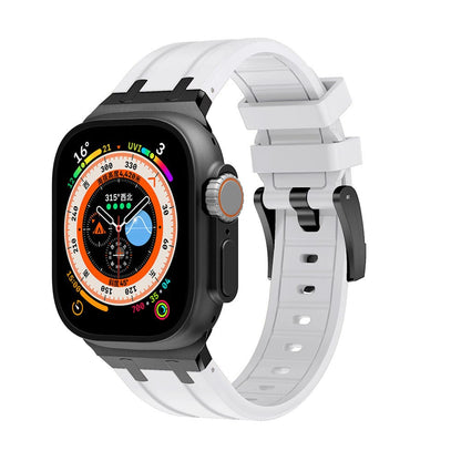 A smartwatch with a rectangular black case and a white silicone strap against a plain white background.