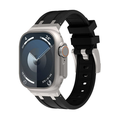 A silver-toned smartwatch with a dark blue circular watch face and a black silicone strap with a metal buckle.