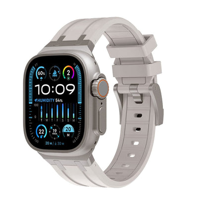 A grey digital smartwatch with a rectangular display and a matching textured silicone strap featuring a buckle closure.