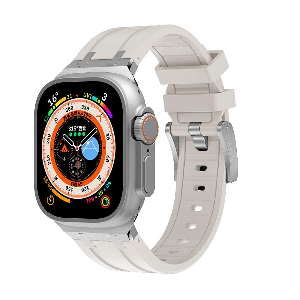 A smartwatch with a rectangular silver case and a light beige silicone strap, featuring a colorful digital watch face with multiple complications.