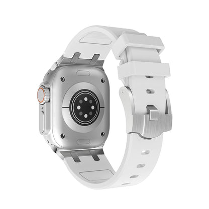 A white silicone watch band attached to a silver rectangular smartwatch casing showing the rear sensor array and side crown against a plain white background.