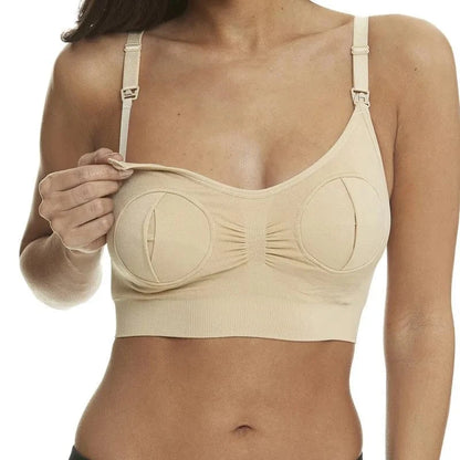 A beige nursing bra on a model, featuring front-opening cups with clips on the shoulder straps.