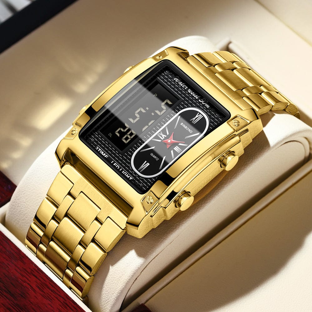 A rectangular gold-toned wristwatch with a dual-display face featuring both a digital screen and an analog clock set in a metallic link band, presented inside an open display box.