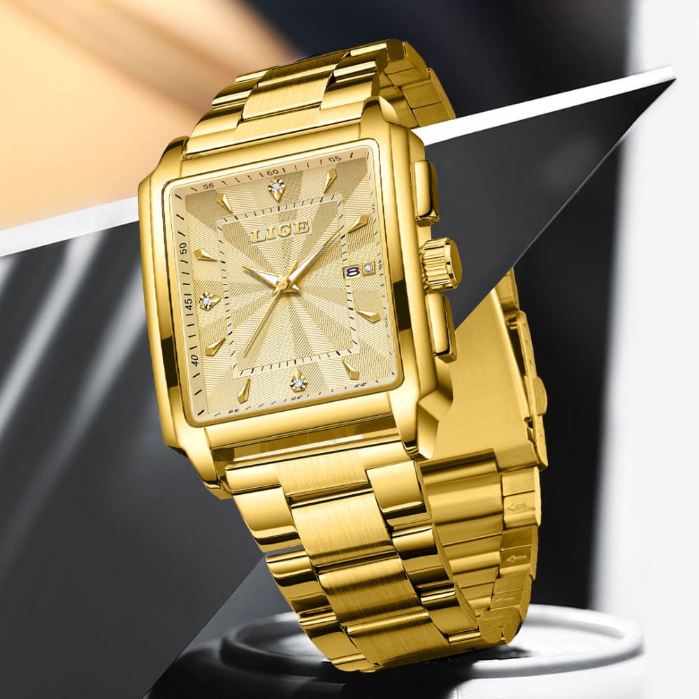 A gold-toned rectangular wristwatch with a textured dial and linked bracelet sits at an angle against a black and white background.