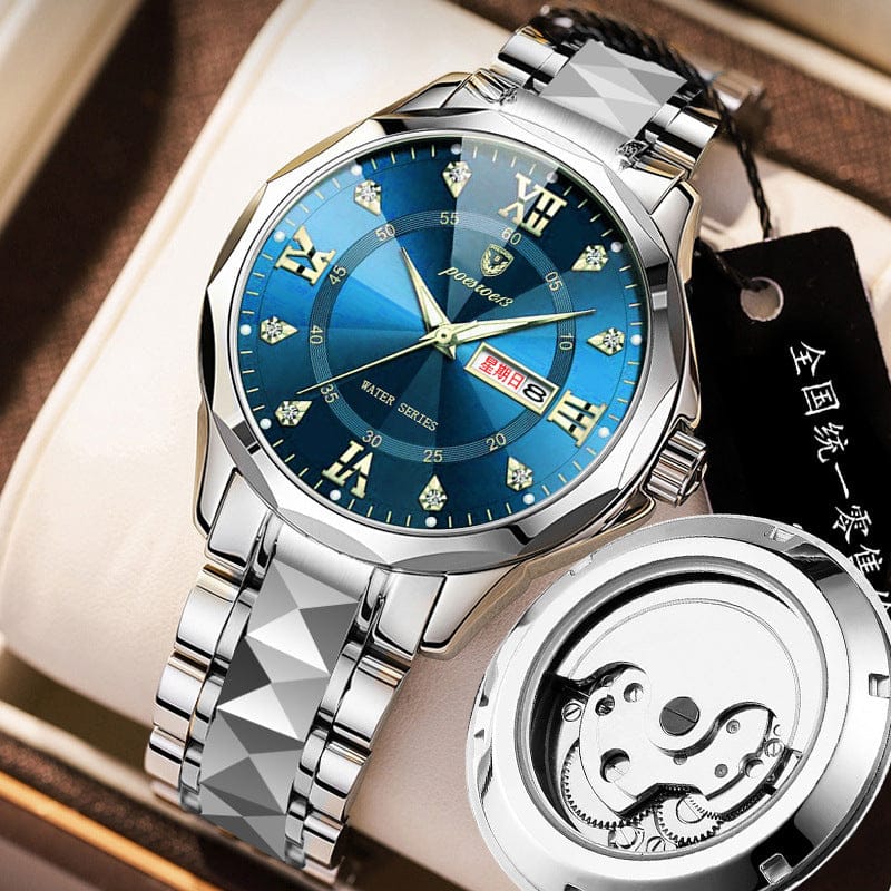 A silver-toned stainless steel wristwatch features a textured link bracelet and a deep blue dial with diamond-shaped hour markers and a date display, displayed alongside its exposed mechanical movement case back.