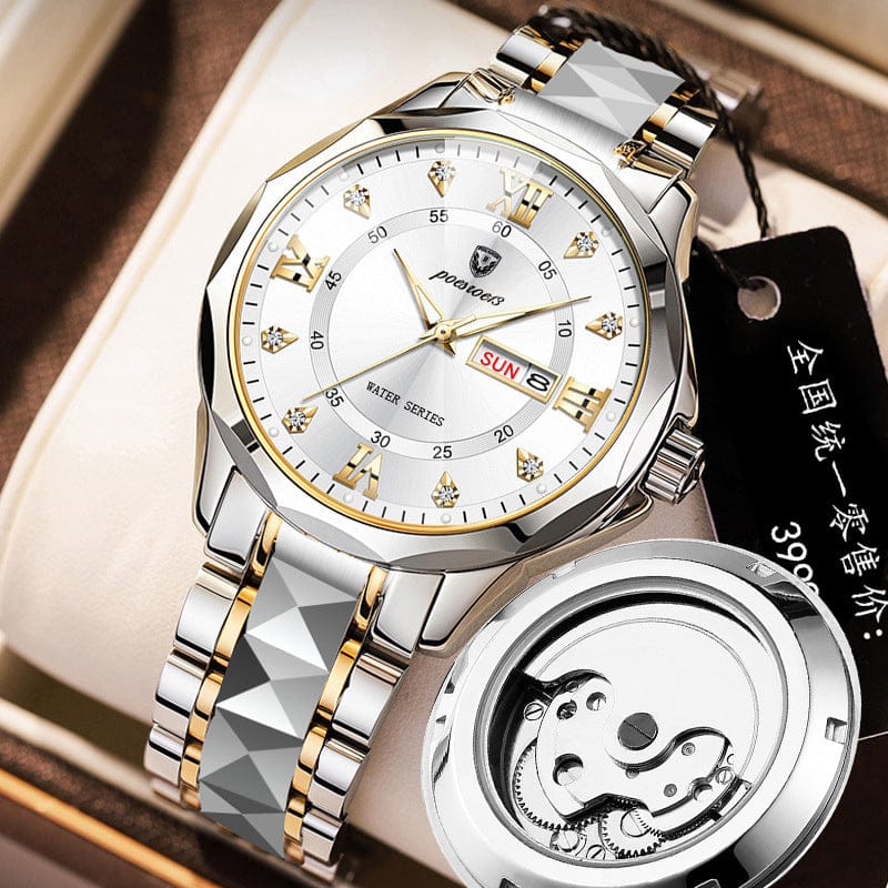 A silver and gold-toned wristwatch with a white face, diamond-style hour markers, and a date display, accompanied by a detached metal watch back showing internal gears.