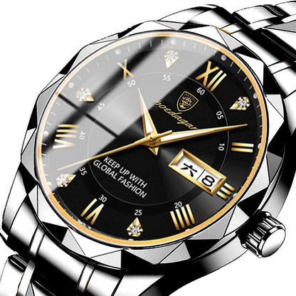 A silver-toned metal wristwatch features a faceted, geometric bezel surrounding a black dial with gold Roman numeral hour markers, diamond accents, gold hands, and a date display window at the three o'clock position.