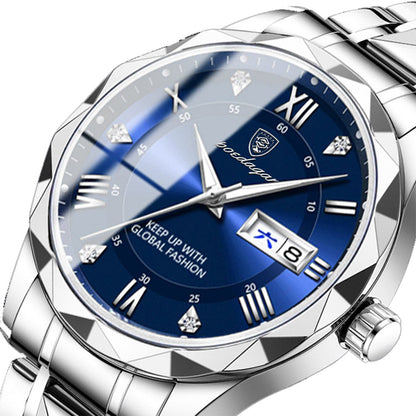 A silver-toned analog wristwatch features a faceted bezel, a blue dial with Roman numeral hour markers, diamond-style accents, silver hands, and a date window displaying Chinese and numeric characters.