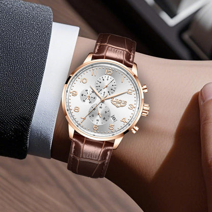 A wrist watch with a white dial, rose gold indices and hands, and three sub-dials, featuring a brown leather strap worn on a wrist.
