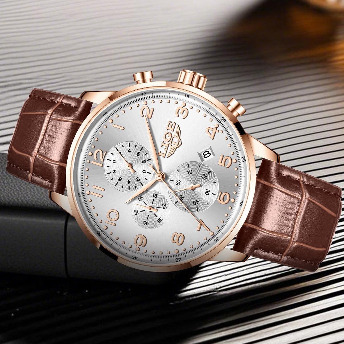 A rose gold wristwatch with a silver dial and brown crocodile-textured leather strap sits on a dark, slatted surface.
