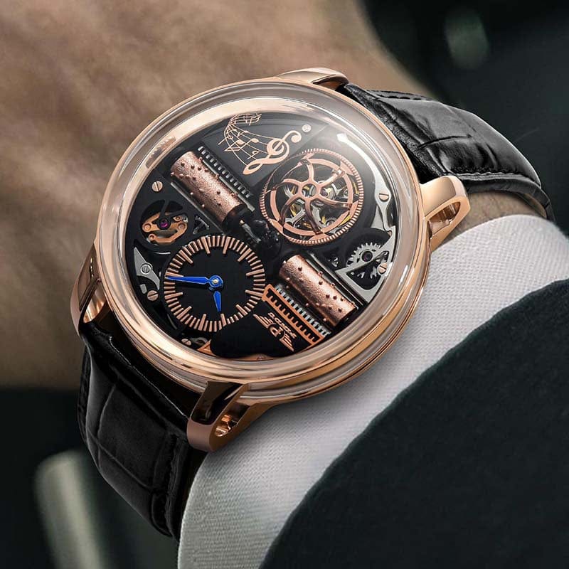 A close-up of a luxury wristwatch with a gold circular case, black leather strap, and an intricate skeleton dial featuring exposed gears, two rotating music box cylinders, and a small clock face with blue hands.