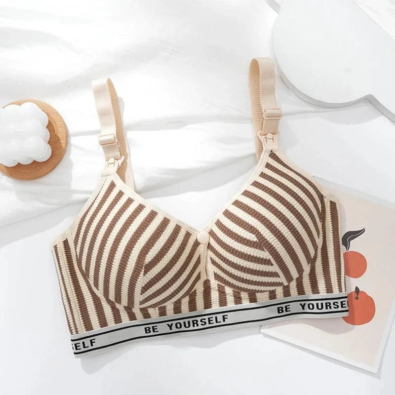 A beige and brown striped maternity nursing bra featuring a wide elastic underband with the text BE YOURSELF printed repeatedly against a white background.