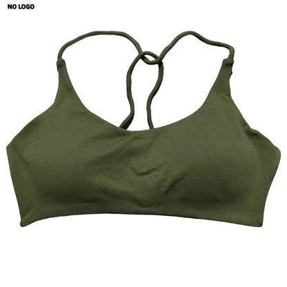 An olive green sports bra with thin, crisscross back straps, featuring a seamless design and a minimalist construction.