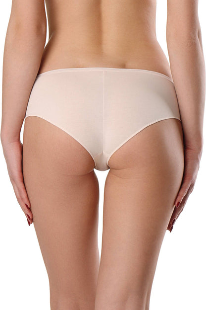 A pair of light beige, full-coverage briefs shown from the back on a person with their hands resting on their hips.