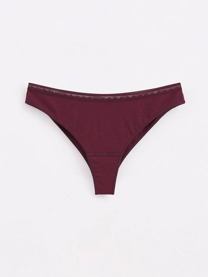 Deep burgundy thong underwear featuring a simple silhouette and a delicate mesh trim along the waistband.