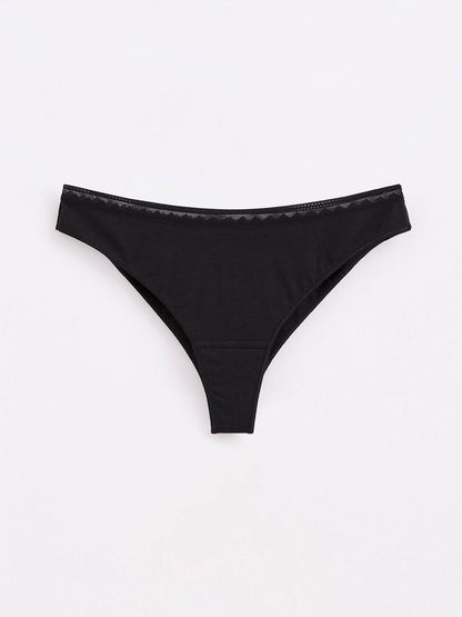 Black cotton thong underwear featuring a minimalist design with a delicate, decorative lace trim along the waistband against a plain light gray background.