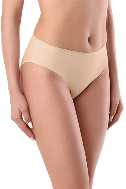 A pair of nude-colored bikini-style panties with a seamless construction worn by a woman.