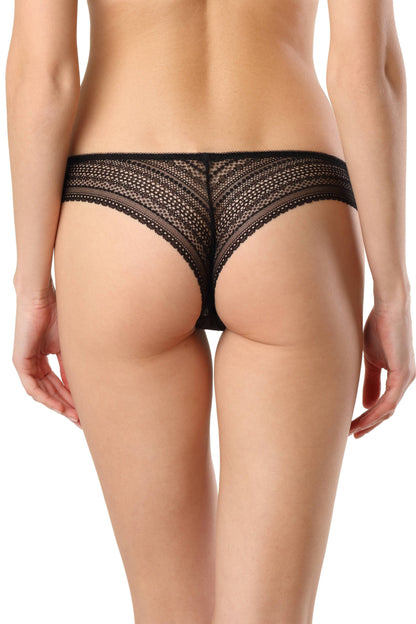 A pair of black lace bikini panties shown from the back on a person with fair skin.